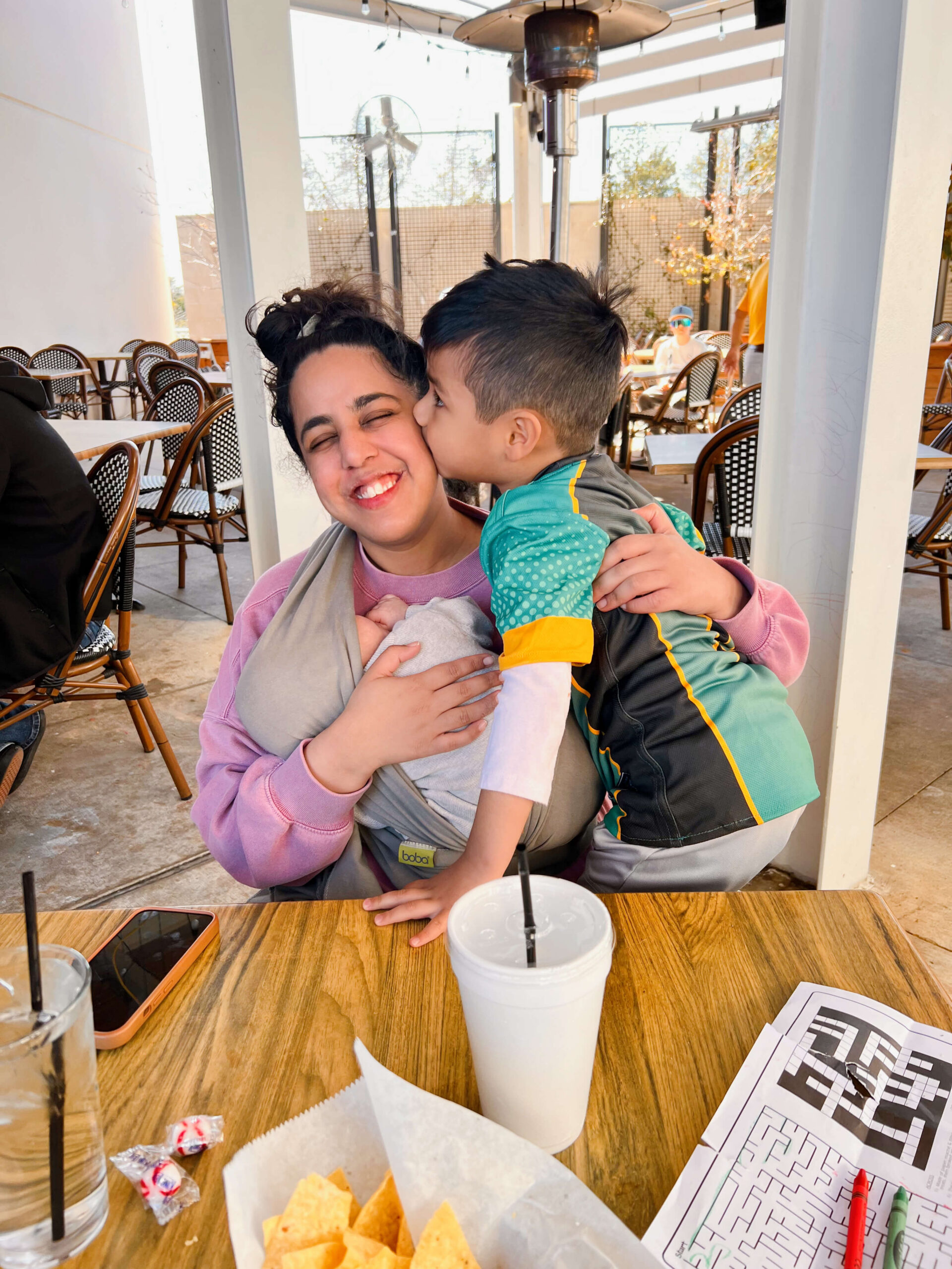 Dr. Vargas smiles with her two children.