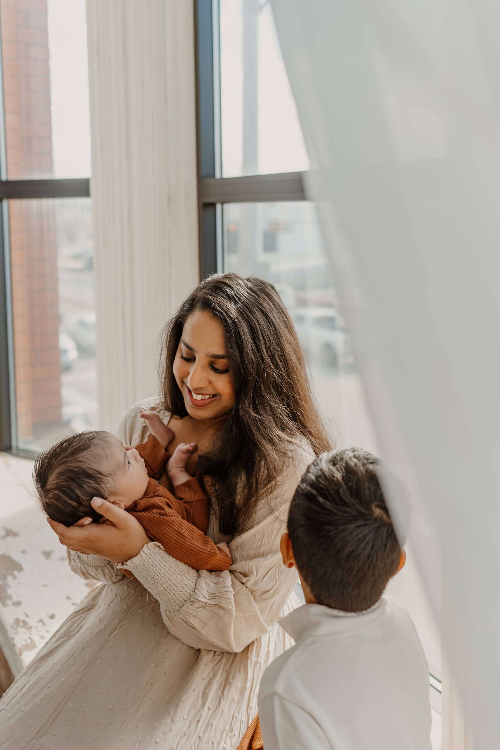 Dr. Vargas smiles at her two children.