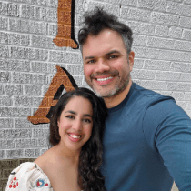 Dr. Vargas and her husband smile together.